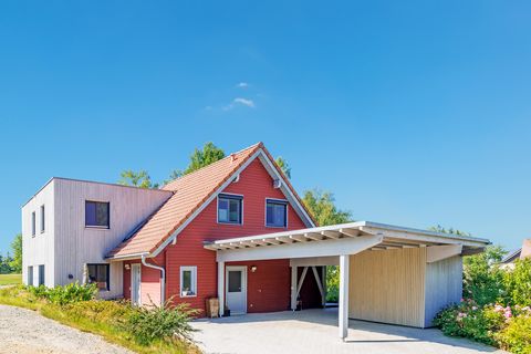 Anbau Holzhaus rote Fassade Wohnraumerweiterung